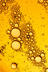 Yellow bubbles and drops of oil background . Yellow water bubbles wallpaper