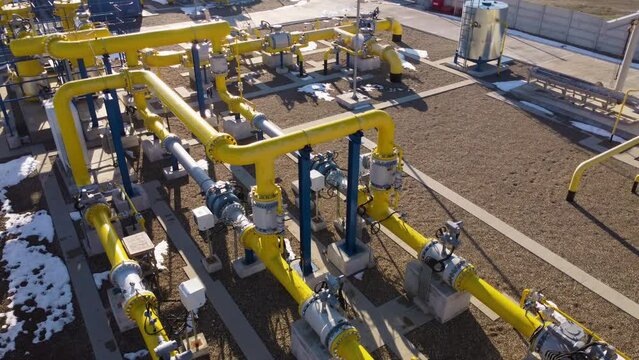Industrial landscape yellow pipes wind way transporting vital liquids crucial production. Whether it's gas oil water pipelines circulatory system factory ensuring smooth flow of essential resources.