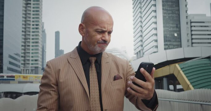 Suited older businessman frustration sadness emotions features etched discontent. Sad emotions mature business person thwarted plans dashed hopes narrative of setbacks in fast-paced world of commerce.