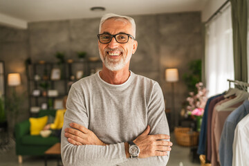 Portrait of one mature senior caucasian man stand and smile at home