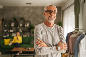 Portrait of one mature senior caucasian man stand and smile at home