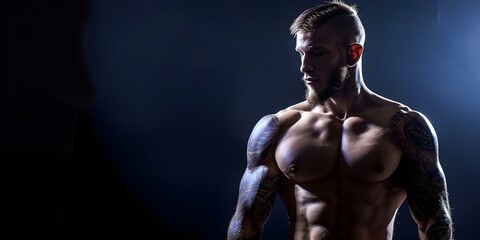 Fototapeta premium Photo of muscular man in tattoo studio against black background. Concept Muscular man, Tattoo Studio, Black Background, Portrait Photography