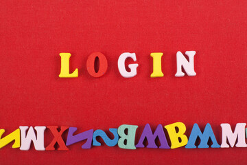 LOGIN word on red background composed from colorful abc alphabet block wooden letters, copy space...
