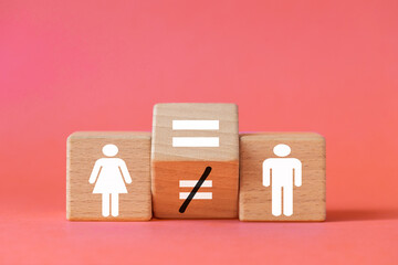 Equal gender balance. Symbol of a woman and a man and a changing equal sign. Equal pay, Parities, Beautiful pastel pink background, copy space