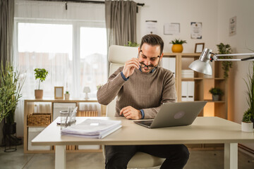 One adult man sit at office put his eyeglasses and prepare for workday