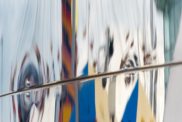 A reflection of a boat is shown in a mirror