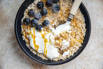 oatmeal with berries healthy breakfast oat porridge fresh cooking appetizer meal food snack on the table copy space food background rustic top view