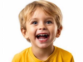 A little boy is laughing on a white background.