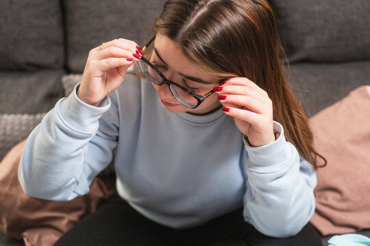 Young Woman Adjusting Her Glasses at Home