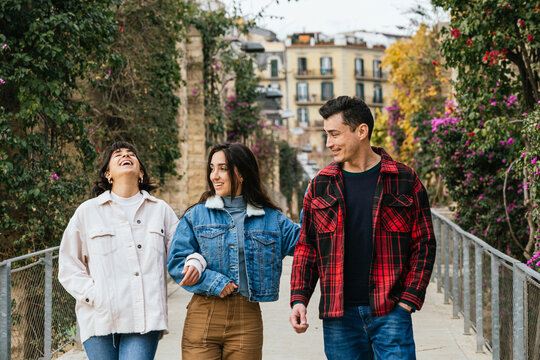 Friends enjoying a leisurely walk outdoors