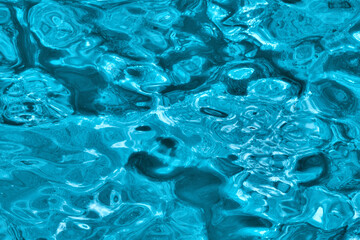 Water background. Abstract blue blurred water surface texture