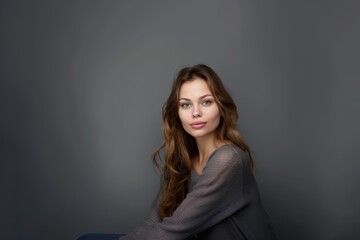 Fototapeta premium Beautiful brunette woman with long hair, radiant perfect skin, beauty industry, beauty and health.