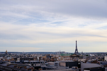 Paris cityscape. Rooftops of the buildings, Eiffel Tower in the background