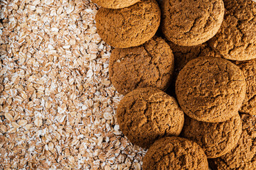 Round brown oatmeal cookies on the oat flakes