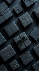 Assorted black gift boxes on dark background