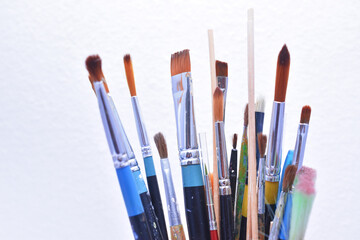 a set of dirty brushes and paintbrushes from having painted too much