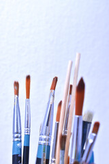 a set of dirty brushes and paintbrushes from having painted too much