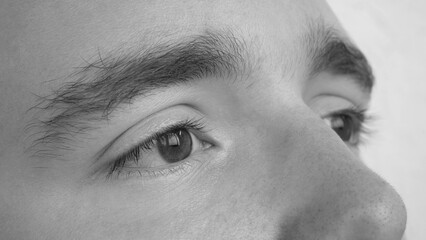 Close-up of a the eyes of a young man looking into a distance