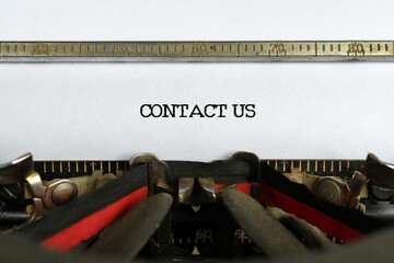 The words Contact Us typed on paper in a typewriter