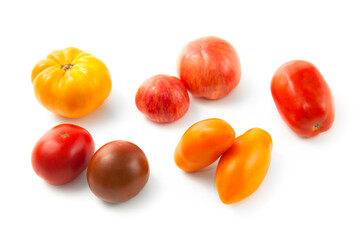 Assort of different shape and color tomatoes isolated on white background with clipping path. .