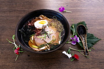 Ramen asiatic bowl on a wooden table