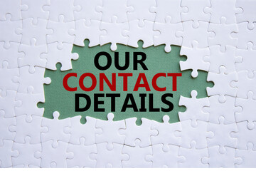 Our Contact Details symbol. Concept words Our Contact Details on white puzzle. Beautiful grey green background. Business and Our Contact Details concept. Copy space.