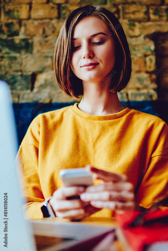 Aufkleber pensive young woman reading incoming notification on smartphone using 4g internet connection during 