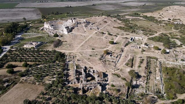 Footage of historical ruins, columns, ancient theater and temples in the ancient city of Miletus.