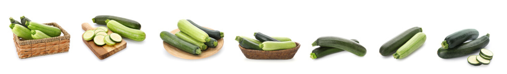 Set of fresh green zucchini on white background