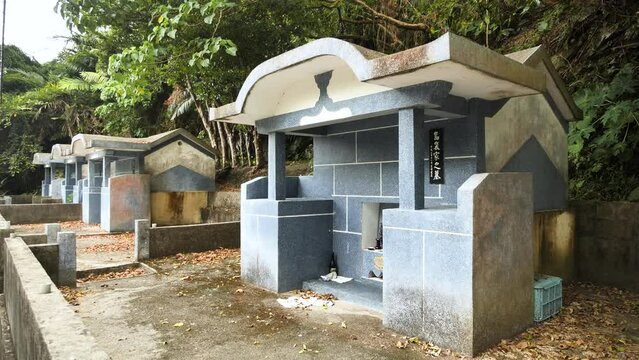 Typical Japanese Cemetery in Okinawa Islands, Japan. The peculiarly shaped Okinawan tombs known as kamekoubaka. The traditional Okinawan turtleback tomb. High quality 4k footage