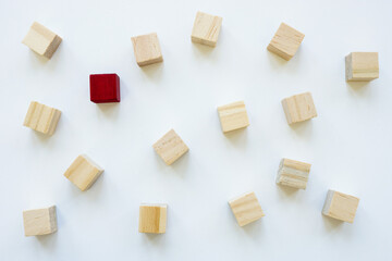 Wooden cubes and one red, stand out from the crowd and be unique.