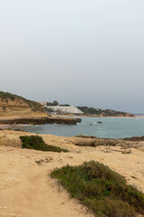 Views of the Cliffside by the Ocean on an Overcast day in Albufiera Portugal