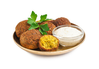Plate with delicious falafel balls, sauce and parsley on white background