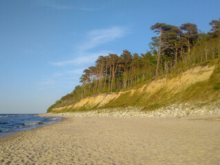 Sandy cliff and beach on the coast of the Baltic Sea. Niechorze, Poland.