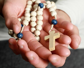 praying to god with cross and hands together with black background with people stock image stock...