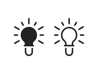 two simple black electricity light bulb icon