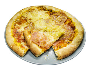 Side view of pizza on a plate with a slice