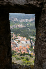 View of Buildings on the Hillside from a Rock Window in the Moorish Castle in Sintra Portugal