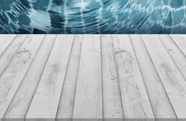 Empty White wooden deck or table top with swimming pool,Top view wood floor over water texture on poolside view,Minimal backdrop banner with copy space for summer vacations accessories