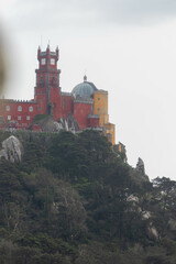 View of the Colorful Sintra Castle from the Moorish Castle in Sintra Portugal