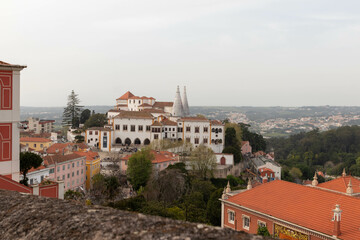 Obraz premium View of Colorful Buildings Stacked Along a Hillside in Sintra Portugal