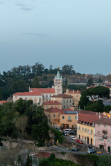 Obraz premium View of Colorful Buildings Surrounding a Tall Elegant Building in Sintra Portugal