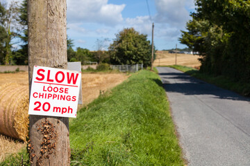 Loose chippings sign at side of road