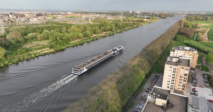 Inland shipping river cruise in Diemen. Aerial drone view. Leisure and vacation.