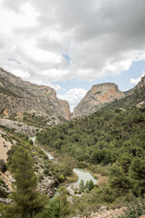 hiking trail caminito del rey, kings walkway, in Malaga Spain. narrow footpath leads through natural beauty mountain range cliff faces of gaitanes gorge. hisotric landmark popular tourist attraction