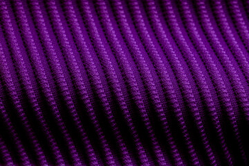 Closeup of violet corduroy cloth as patterned textured background