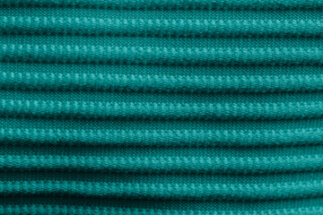 Closeup of green corduroy cloth as patterned textured background