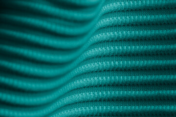 Closeup of green corduroy cloth as patterned textured background