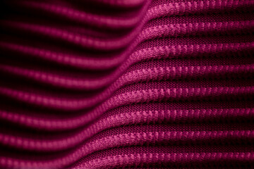 Closeup of pink corduroy cloth as patterned textured background