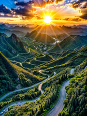 The sun is setting over winding road in mountainous area with trees and mountains.